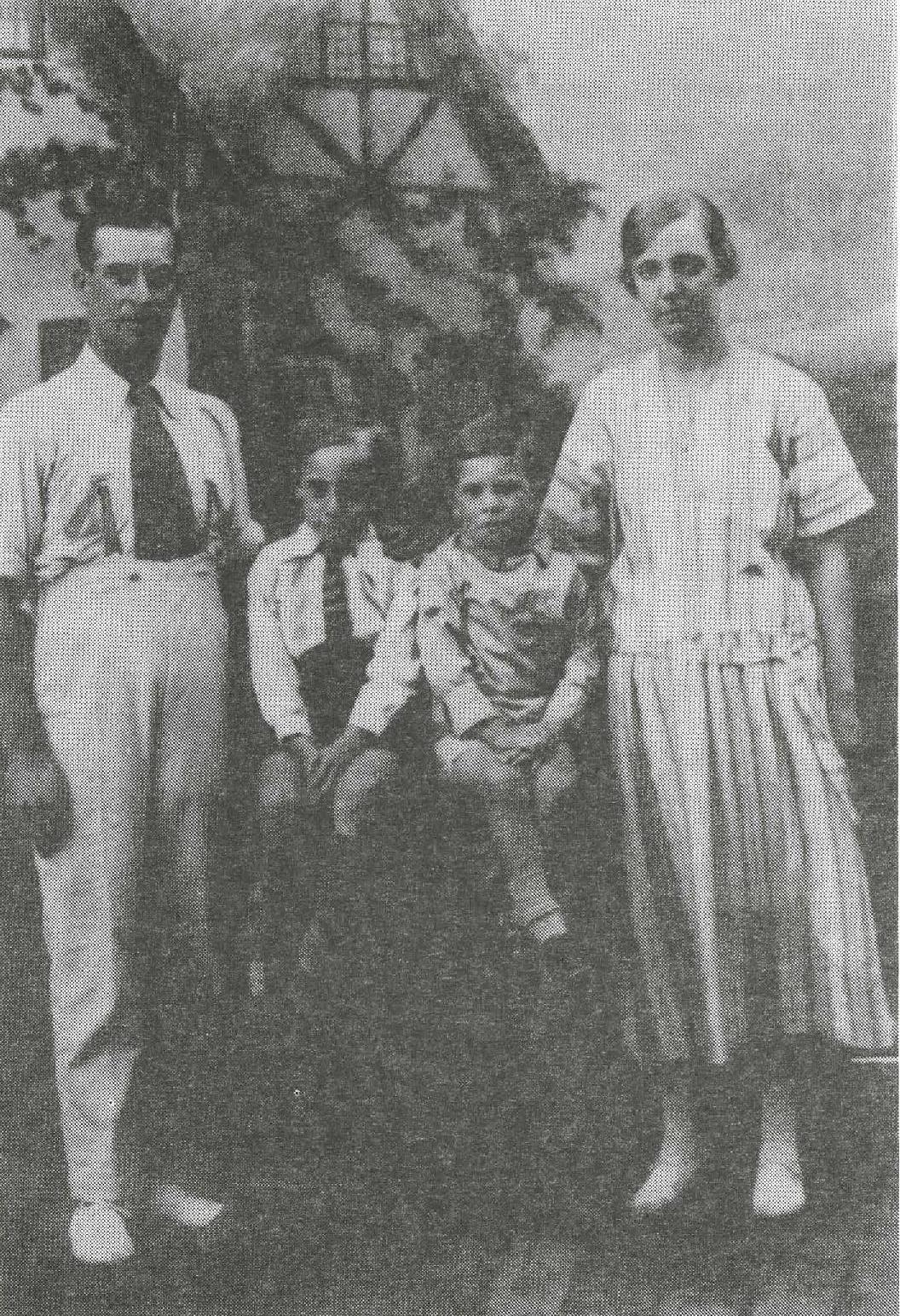 Leslie and Roy with their parents Job and Annie. Holiday portrait 1925
