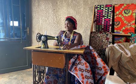 Chantal sits at her sewing machine.