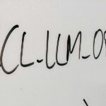 Photograph of a whiteboard with “ZCL-LLM-OPENAI” written on it.