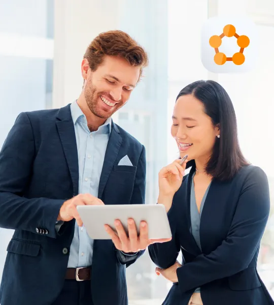 Two professionals reviewing microservices platforms on a laptop