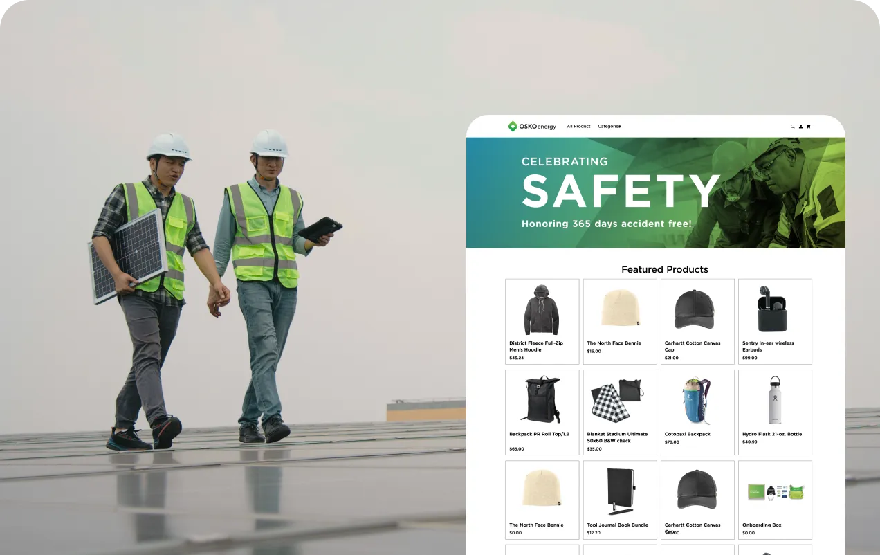 Two workers wearing safety helmets and reflective vests walking on solar panels, one holding a solar panel and the other a tablet.