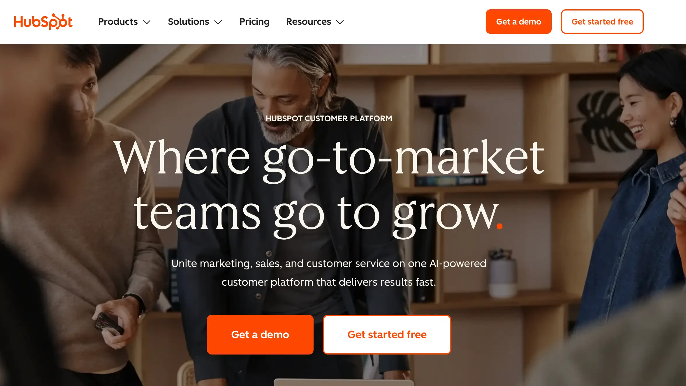 Mailchimp alternative, HubSpot. This shows a group of people collaborating. 