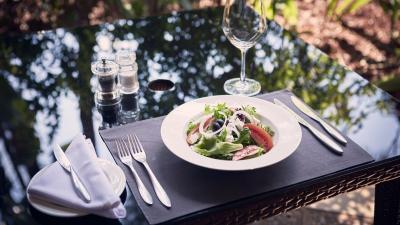 A plate of food served at the Delegates lounge of the United Nations Office in Nairobi, with cutlery set on a table.