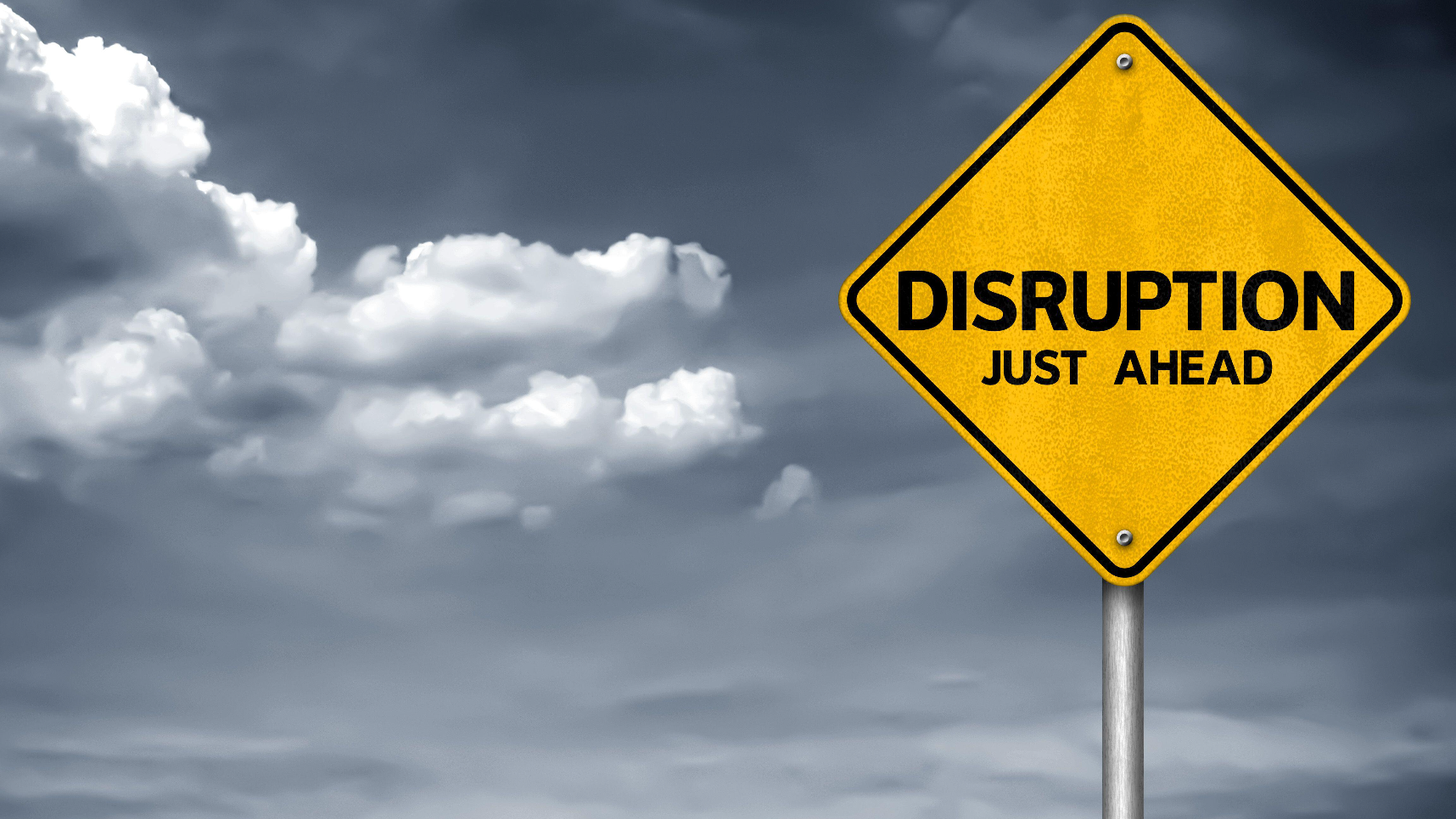 road sign warning "Disruptions Just Ahead"