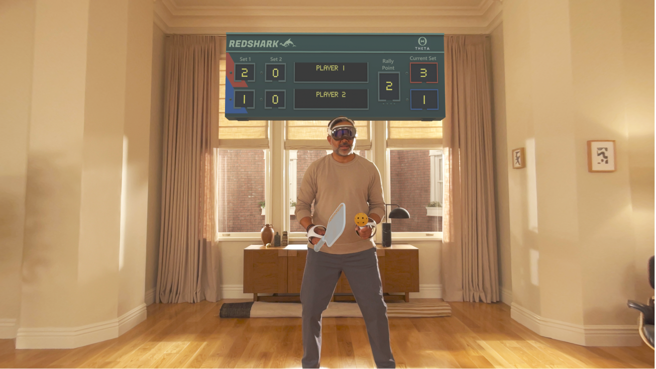 一个人正在 Apple&nbsp;Vision&nbsp;Pro 上使用连接的控制器玩 Apple Arcade 中的游戏。