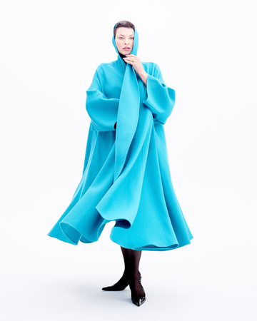 a model showcasing an oversized aquablue garment