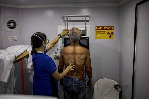 Truck driver Johnny is given a free chest X-ray at one of MSF's active case finding sites for tuberculosis on March 13, 2023 in Tondo, Manila, Philippines.
