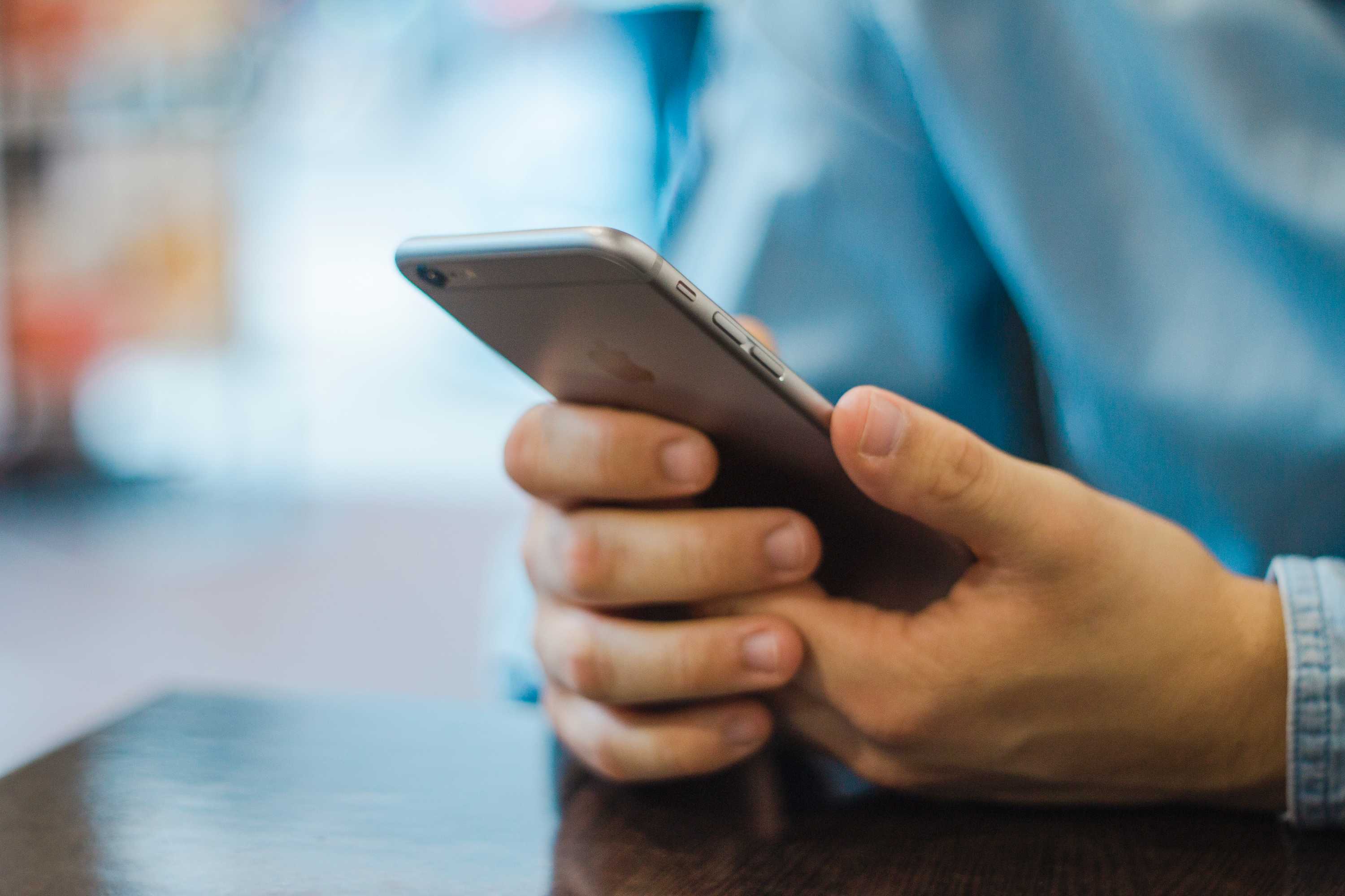 A man holding a mobile phone.