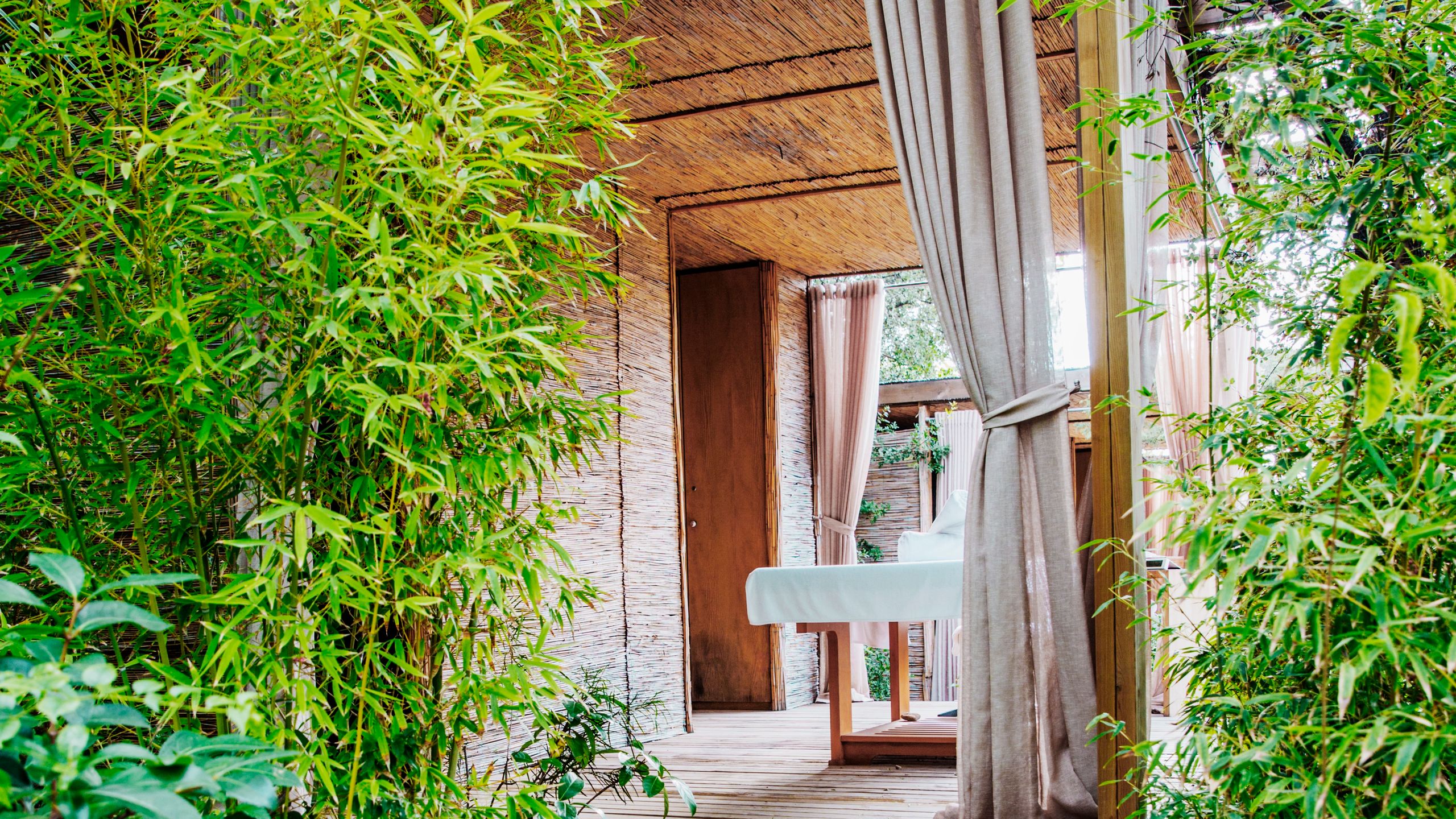 Image may contain: Wood, Building, Housing, Plant, Outdoors, Garden, House, Cottage, and Arbour