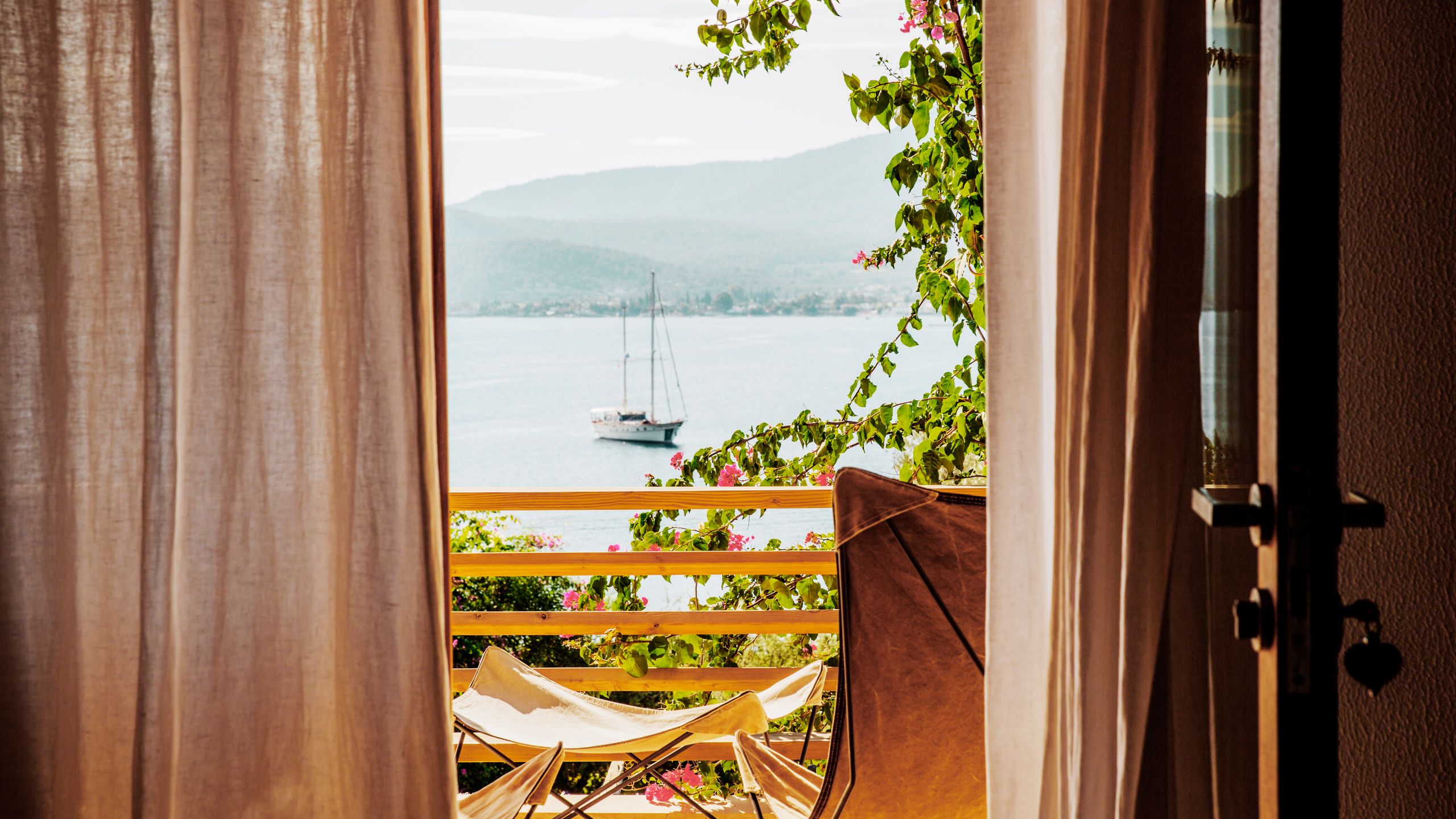This image may contain Vehicle, Transportation, Boat, Balcony, Home Decor, Window, Furniture, and Chair