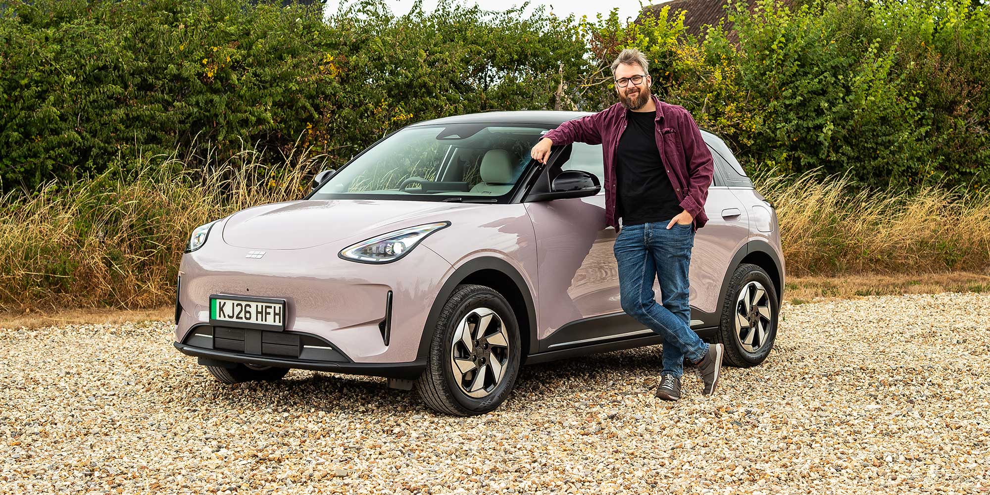 Michael Passingham standing next to a 2026 Geely Ex2