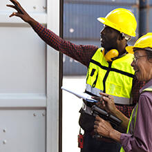 Workers opening a container