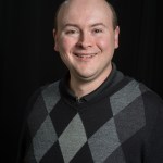 A portrait photo of NASA scientist Samuel Lawrence.