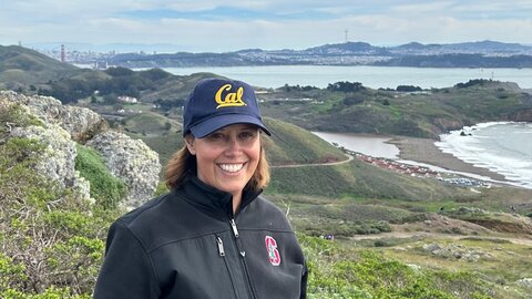  Young researcher with shield cap, Berkeley Bay Area in the background