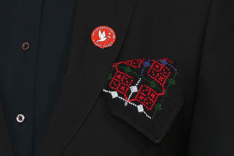 Arab-Israeli actor Amer Hlehel wears an "Artists4Ceasefire" pin as he attends the 98th Annual Academy Awards at the Dolby Theatre in Hollywood, California on March 15, 2026.