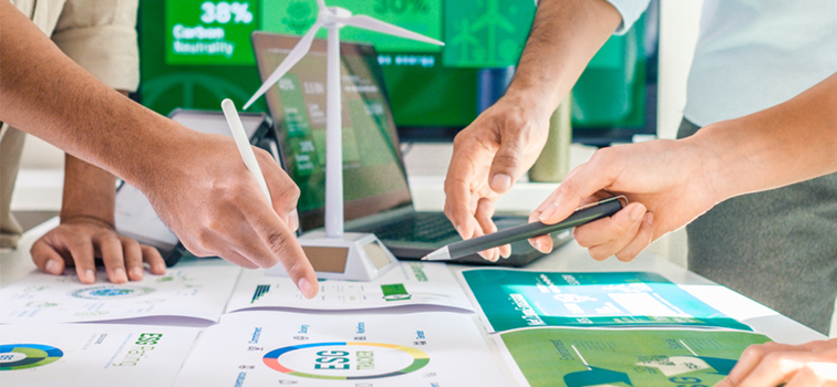 Hands pointing at data sheets