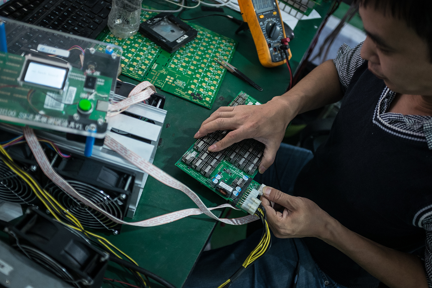 A researcher works in a lab at Bitmain’s manufacturing base, Shenzhen, November 9, 2016. 