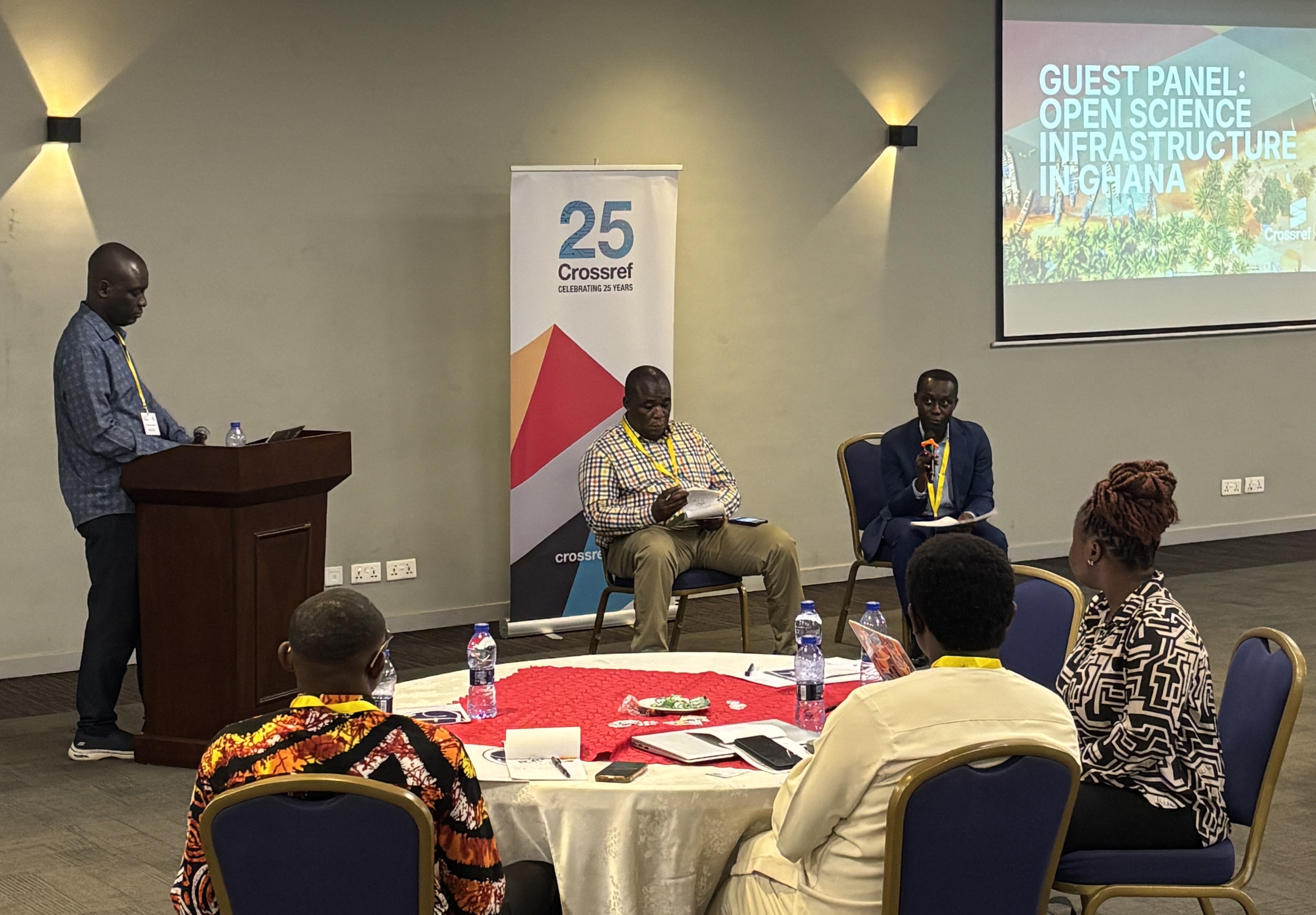 Photo: Crossref Ambassador Richard Lamptey moderates a panel with WACREN’s Effah Amponsah, CARLIGH’s Mac Anthony Cobblah, and AJOL’s Kylie van Zyl on sustaining journals and advancing Open Access in the region.