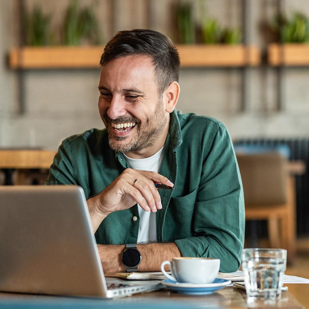 Man videoconferencing on his laptop