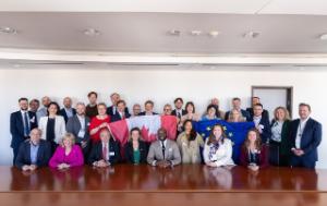 The delegation from the Canadian Chamber of Commerce together with Members of the European Parliament, including the Chair of Parliament's Delegation for relations with Canada after their meeting on 9 June 2026 at the European Parliament. Some  are holding the EU and Canadian flags.