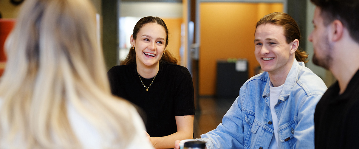 Students sitting at a table talking