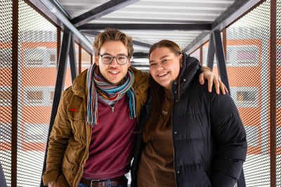 Two students smiling at camera