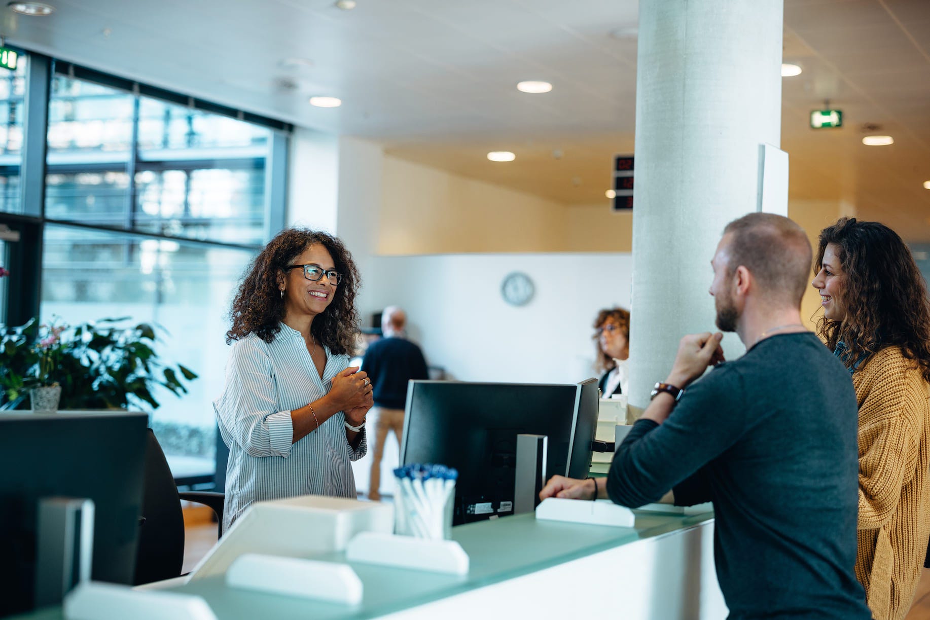 person chatting at an office reception desk