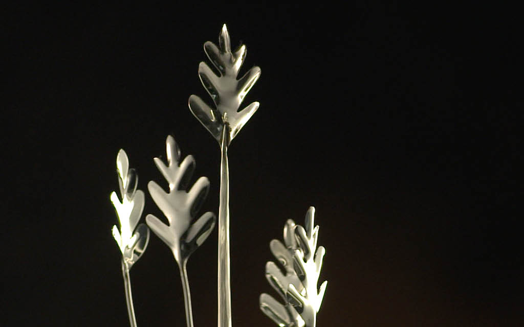 Close up of the silver Alumni Achievement Awards trophy which depicts silver oak leaves