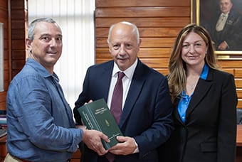 Professor Carmel Borg and Dr Charmaine Bonello presenting MRER publication to Professor Alfred J Vella