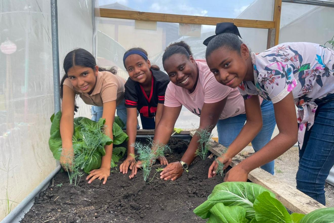 girls cultivating plants