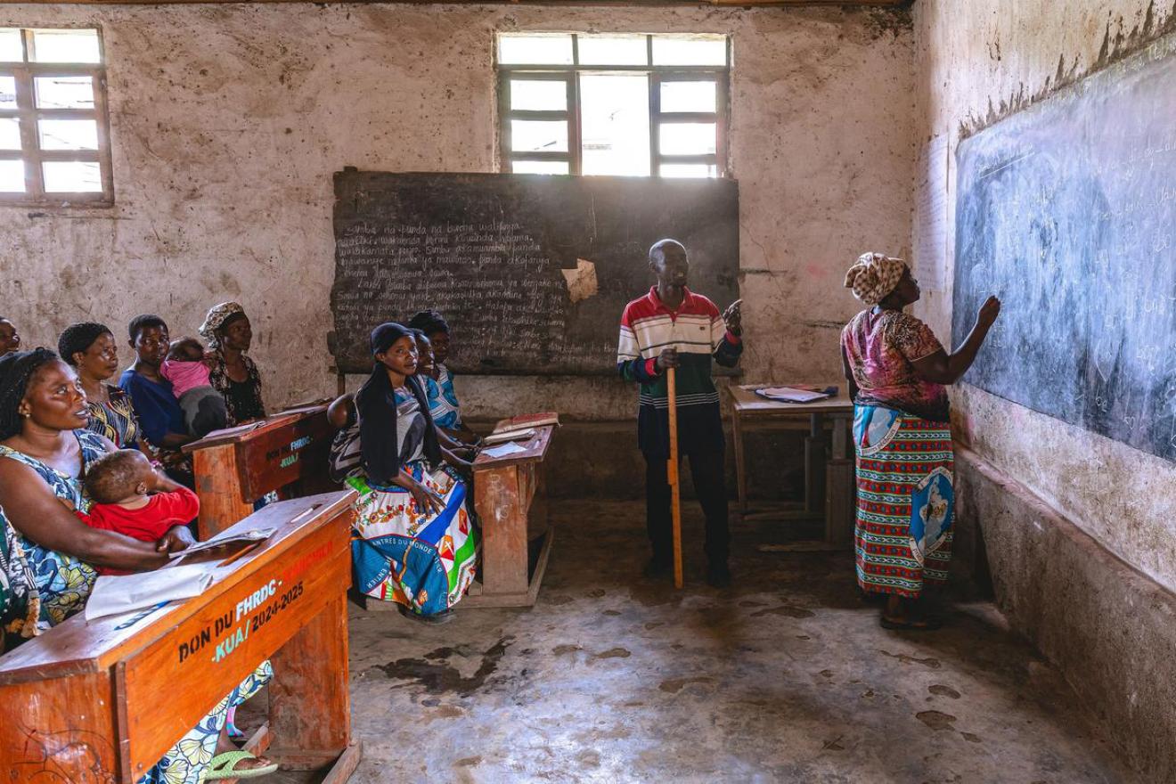 A classroom full of adults learning.