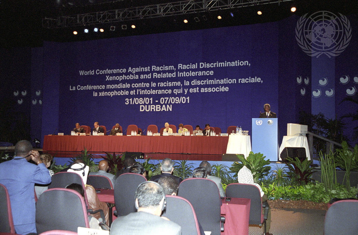 Secretary-General Kofi Annan (right at podium) speaking at the opening of the World Conference Against Racism, Racial Discrimination, Xenophobia and Related Intolerance in Durban.