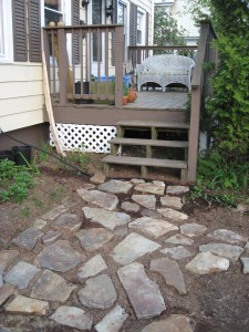 Drip line running across the stone path
