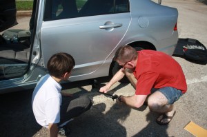 IMG_6159 My man changing the tire! Get 'er done baby!