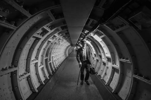 Time Tunnel Travelling through time in the time tunnel. The Doctor comes up through the cast iron tunnel running below The Thames. There are many interesting characters in London with many interesting places to find them. Greenwich foot tunnel is an ancient tunnel that runs from one side of the huge Thames River to the other.