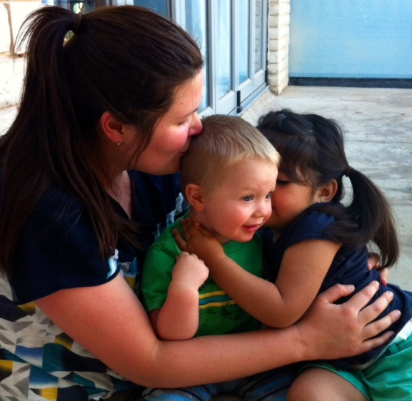 Grandson, Finn enjoying kisses from his aunt and .cousin, Javi
