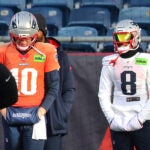 The NE Patriots held practice at Gillette Stadium. QB Drake Maye (left) and Stefon Diggs stand apart during drills.