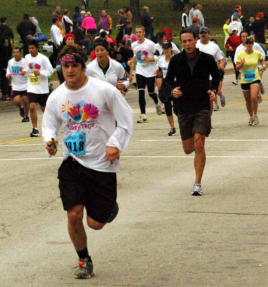 Near the end of the eight mile race, there is a steep hill to torture the runners. I always wait there to see my kids run by. Here is Lee a hundred yards from the finish.