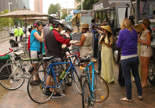 While I was eating, a rugged group on Bicycles, braving the rain, came up for some food.