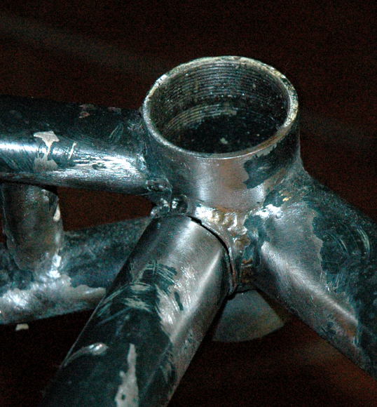 The crack in the seat tube at the bottom bracket.