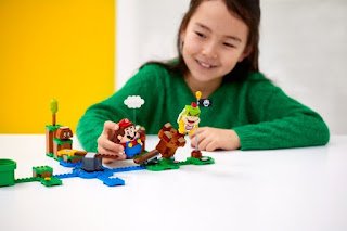 LEGO Super Mario Toys, LEGO plus Super Mario Brothers Girl is playing with LEGO Super Mario Toys