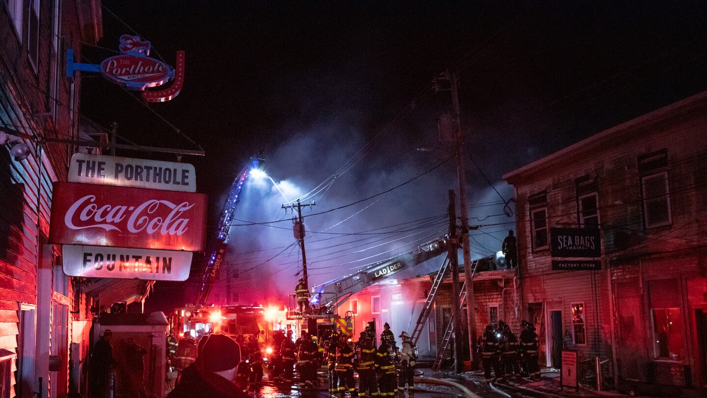 Firefighters battled the blaze on the historic Old Port waterfront Friday in Portland, Maine.