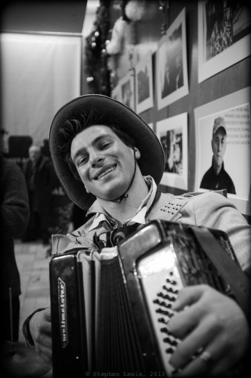 Music at the premiere was provided by a high-spirited, virtuoso Roma (Gypsy) accordionist, with the very non-Bulgarian, non-Roma name of "Jimmy." Jimmy reinforces his seemingly American moniker with a seemingly American cowboy hate. Johnny invited Jimmy to the premiere after hearing him play on the street nearby. It was Jimmy's fault that I danced rather than photographed! (Fuji X100, specs as per above). Click on image to enlarge.