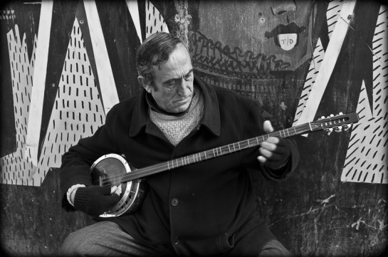 Musician playing tambur, Istiklal Caddesi, Istanbul, 2012. Fuji X100. Click on image to enlarge.
