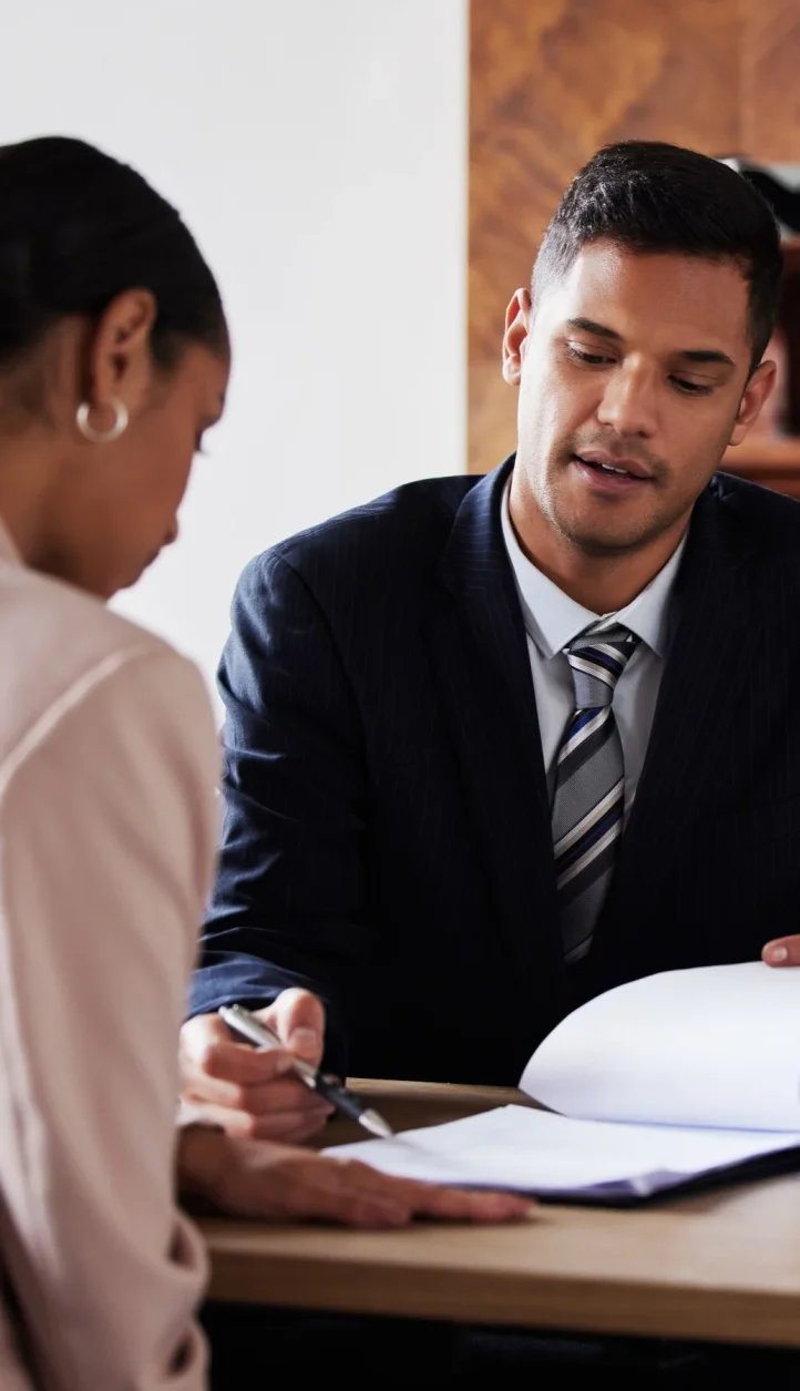 An attorney explains federal regulations, UETA and E-SIGN Act, to a client and shows a list of legal documents where electronic signatures are not applicable and require traditional signatures to be valid.