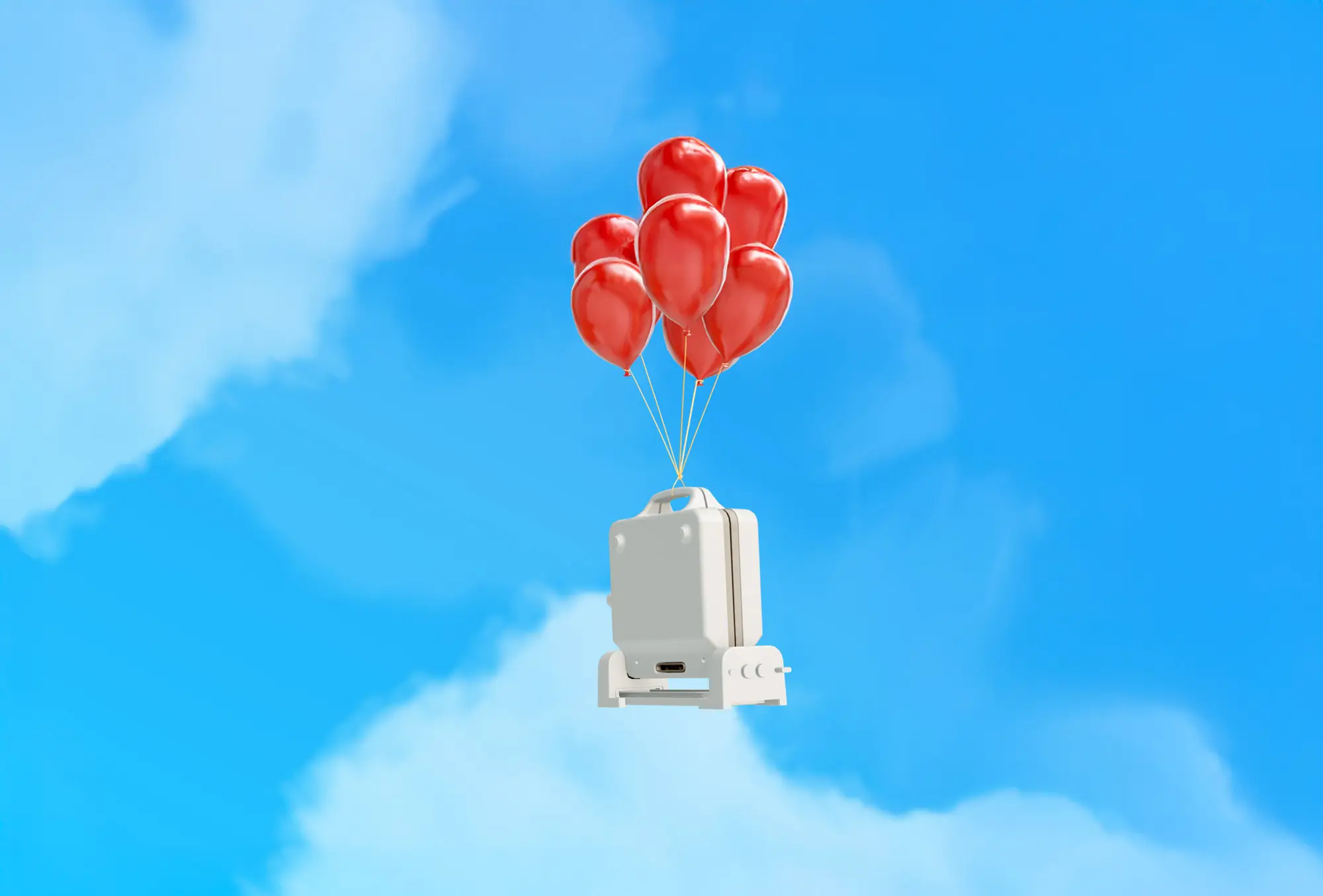 White suitcase lifted into a blue sky by a cluster of seven red balloons.
