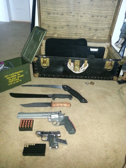 Contains of the kit: Portable Saw, Machete, Bowie Knife, Raging Bull .44 Magnum, Cobra 380, Ammunition. Not in the picture: .22 Long Range Rifle, and a Handheld Crossbow.