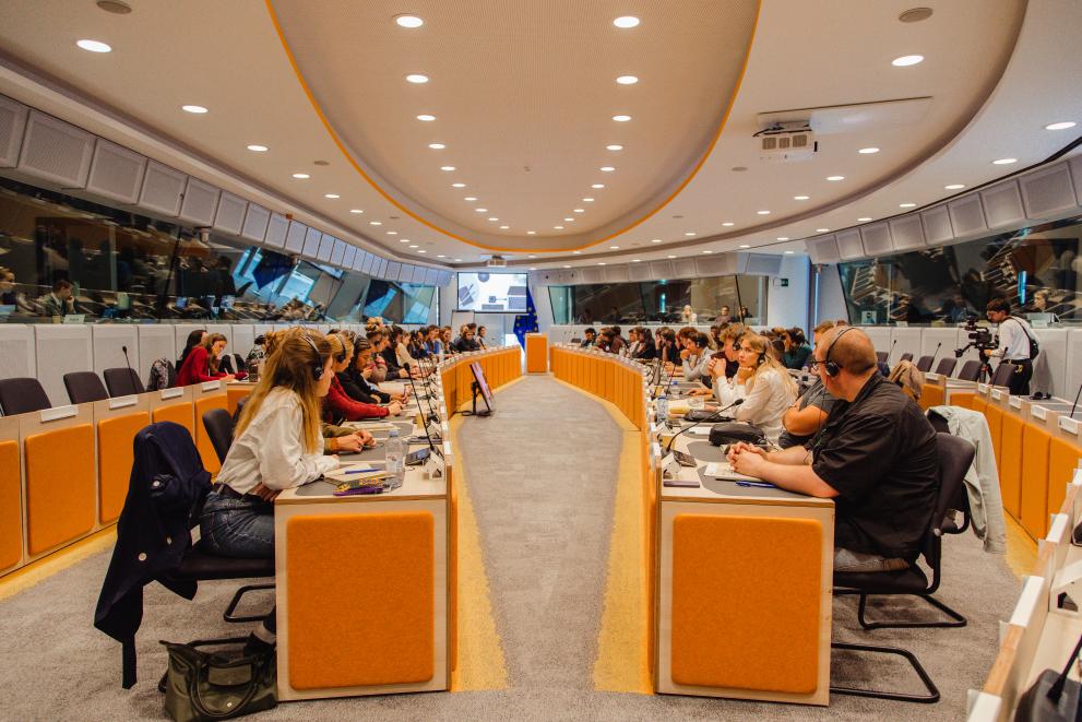 Individuals depicted in the picture are young citizens discussing with stakeholders during the Assembly.