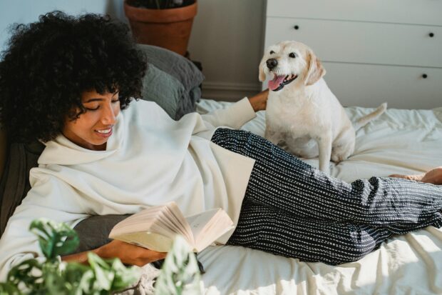 dog mom reading book with dog