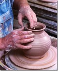 Potter Crafting Pot on Potter's Wheel